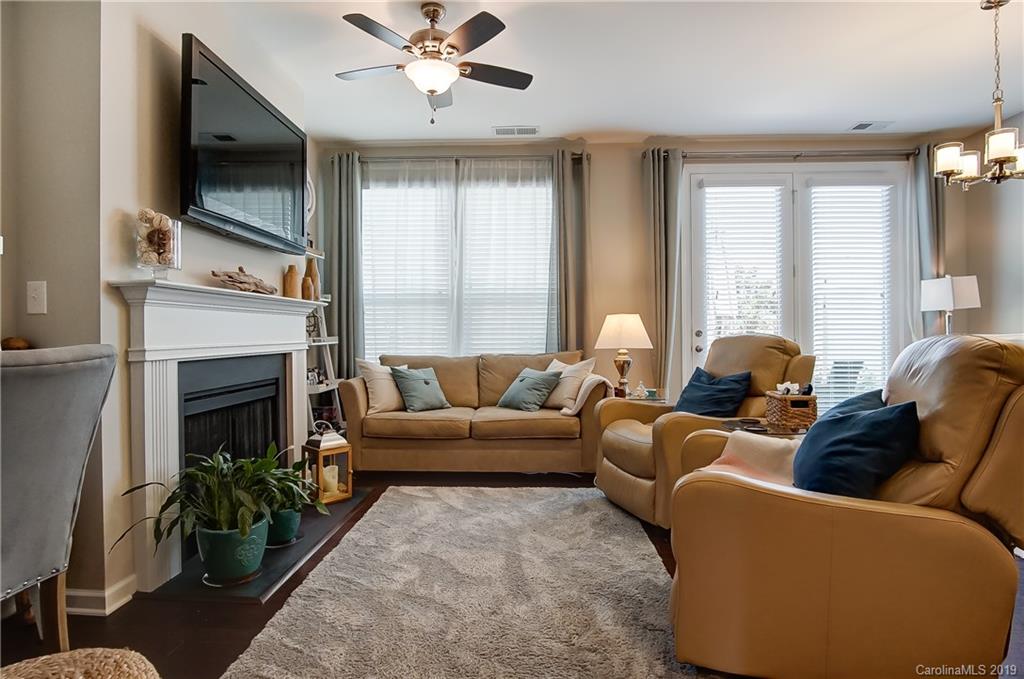 827 Ayrshire Avenue Fort Mill, SC 29708 - Photo 8 of 47 a living room with furniture a flat screen tv and a fireplace