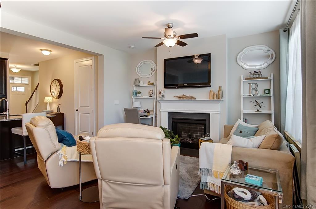 827 Ayrshire Avenue Fort Mill, SC 29708 - Photo 9 of 47 a living room with furniture a flat screen tv and a fireplace