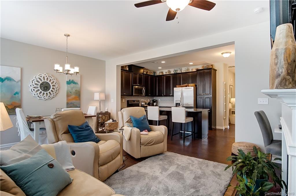 827 Ayrshire Avenue Fort Mill, SC 29708 - Photo 10 of 47 a living room with furniture kitchen view and a chandelier