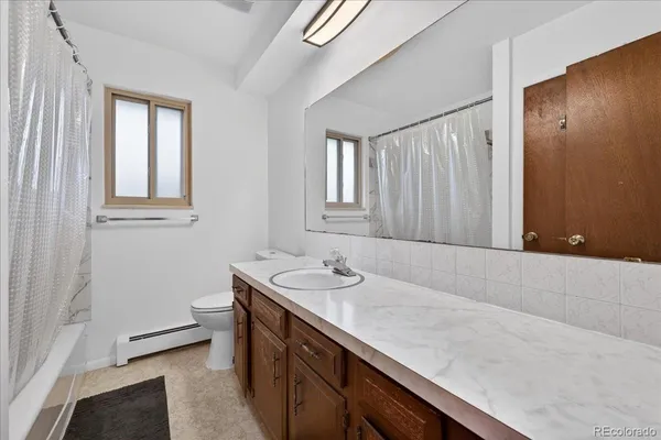 a bathroom with a sink a vanity and a mirror