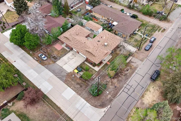 an aerial view of a house with a yard