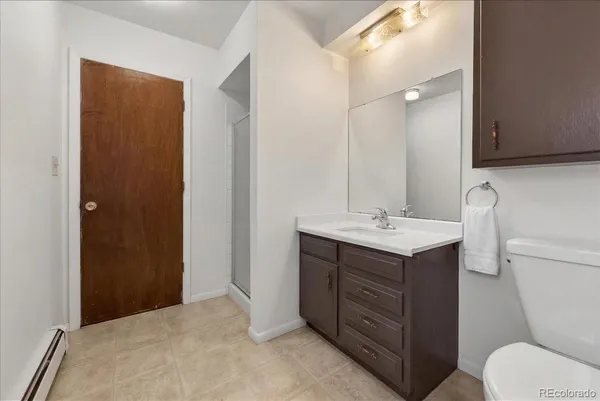 a bathroom with a sink toilet and vanity
