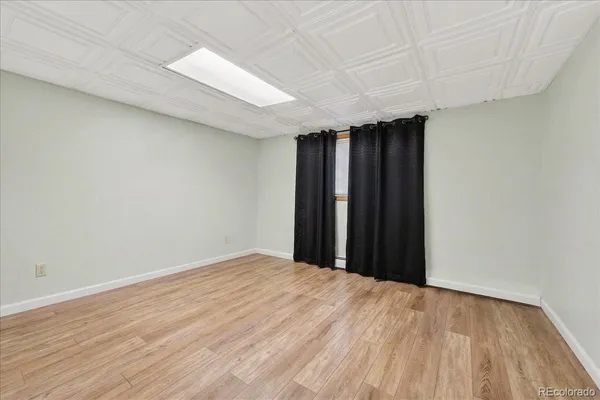a view of a room with a wooden floor