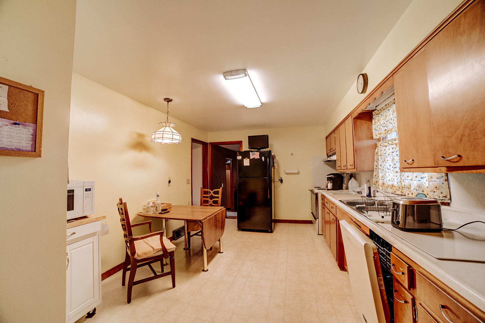1505 North 2000 East Road Watseka, IL 60970 - Photo 20 of 39 a kitchen with a sink and cabinets