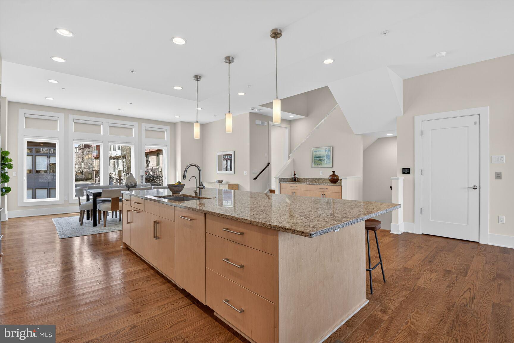 5320 Merriam Street Bethesda, MD 20814 - Photo 15 of 51 a kitchen with center island appliances and wooden floor