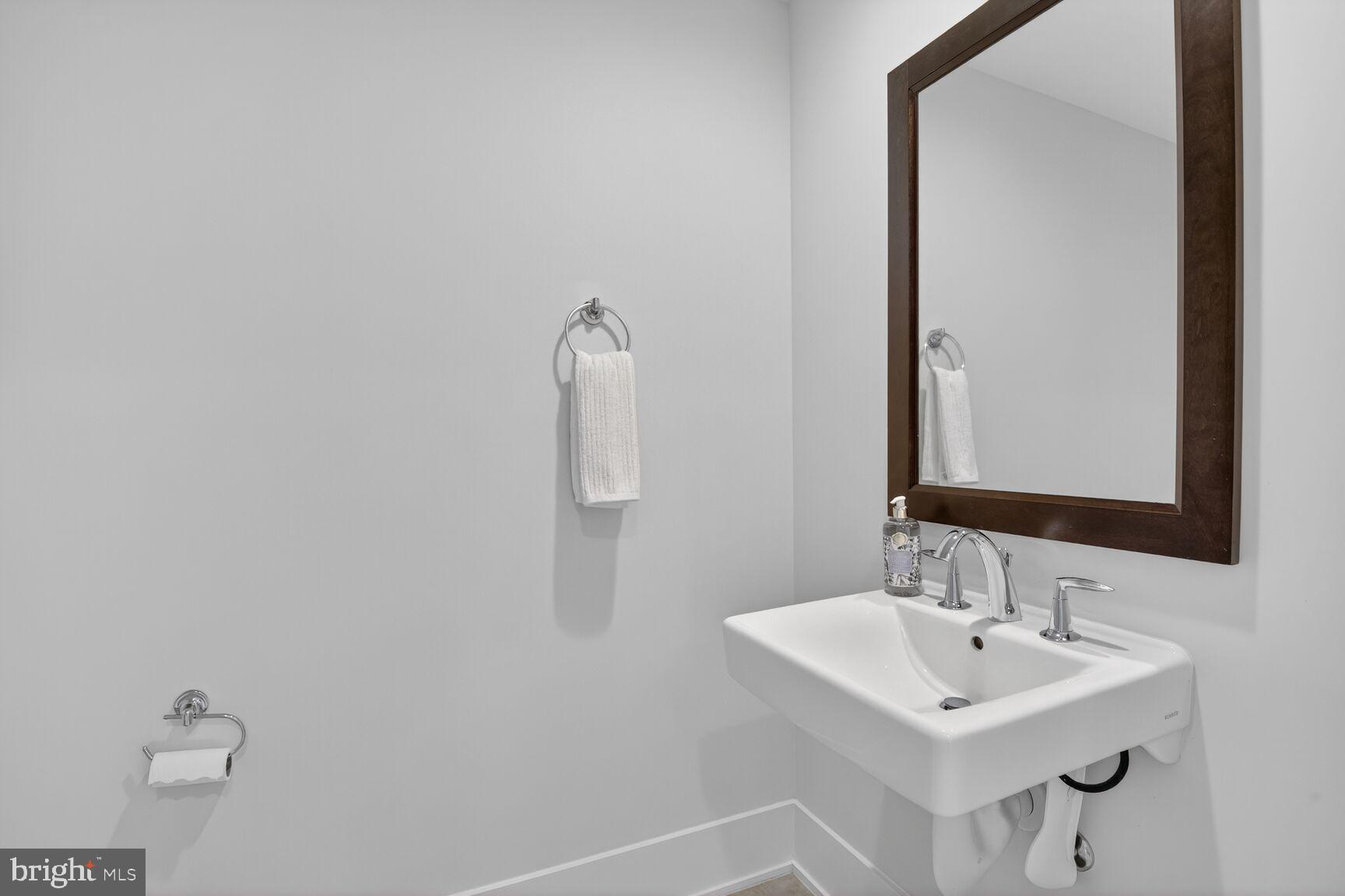 5320 Merriam Street Bethesda, MD 20814 - Photo 22 of 51 a bathroom with a sink and a mirror