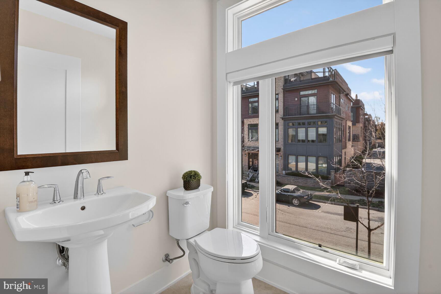 5320 Merriam Street Bethesda, MD 20814 - Photo 28 of 51 a bathroom with a toilet sink and shower