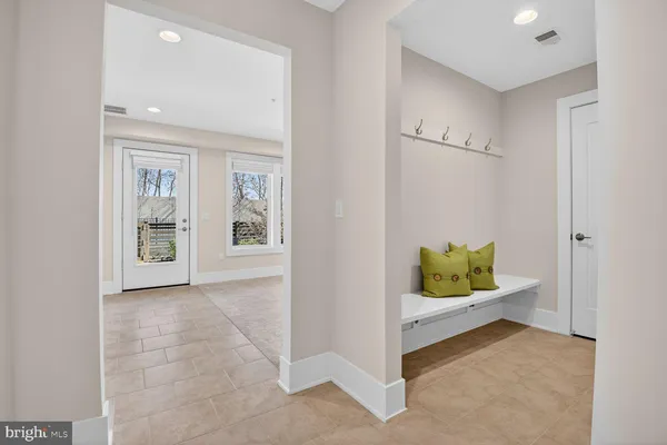 a view of an entryway and wooden floor