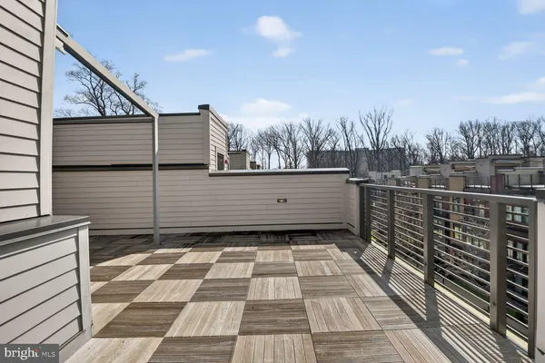a view of a balcony with trees