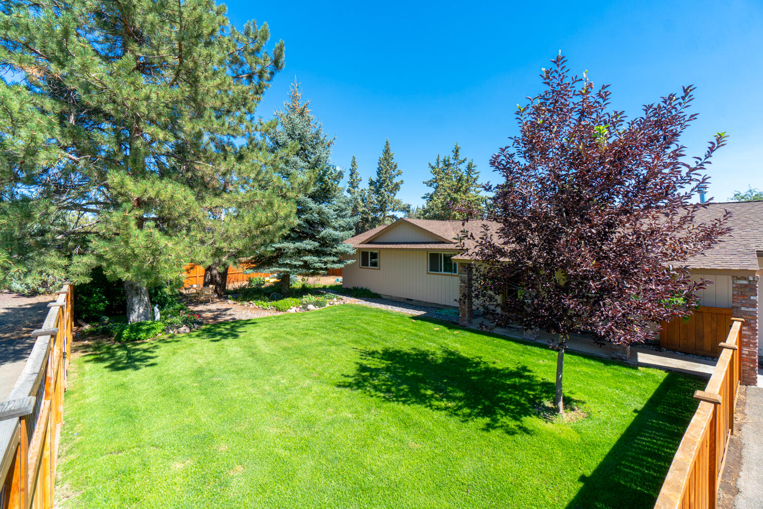 2218 Southwest 79th Street Redmond, OR 97756 - Photo 35 of 54 a view of backyard with swimming pool and green space