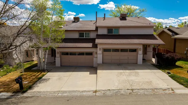 a front view of a house with a garage