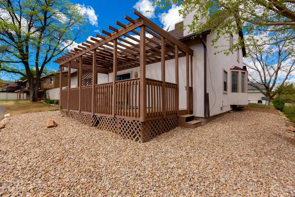 a view of a backyard with a tree