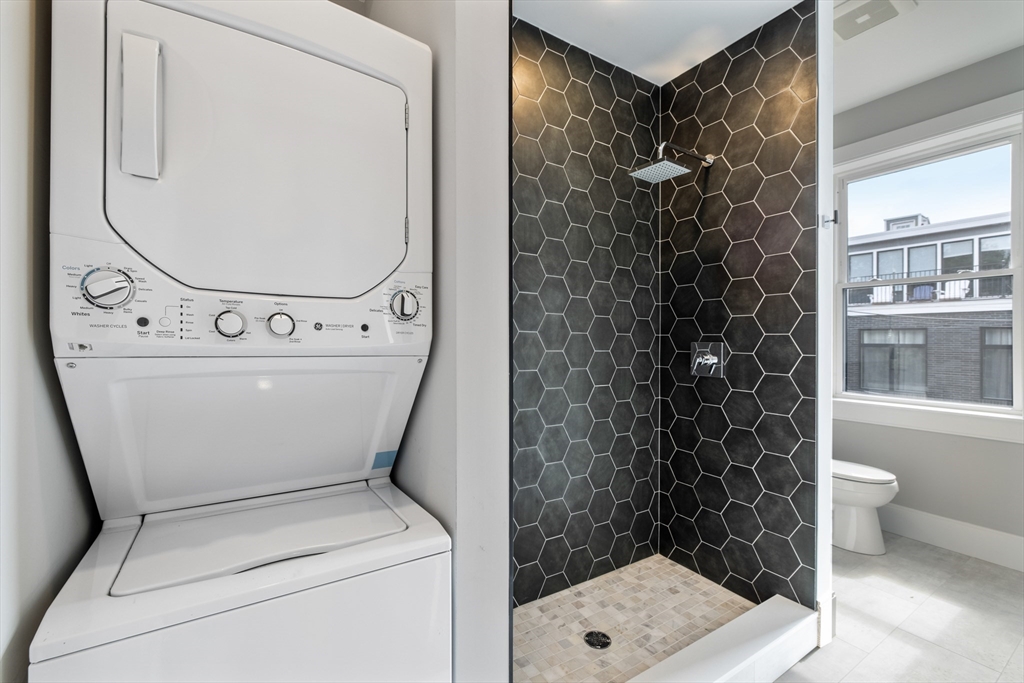 66 Lubec Street Boston, MA 02128 - Photo 5 of 8 a utility room with dryer and washer