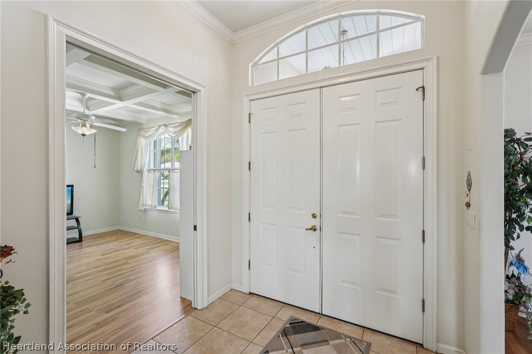 107 Orange Road Northeast Lake Placid, FL 33852 - Photo 11 of 47 Front Door - Leading to Den