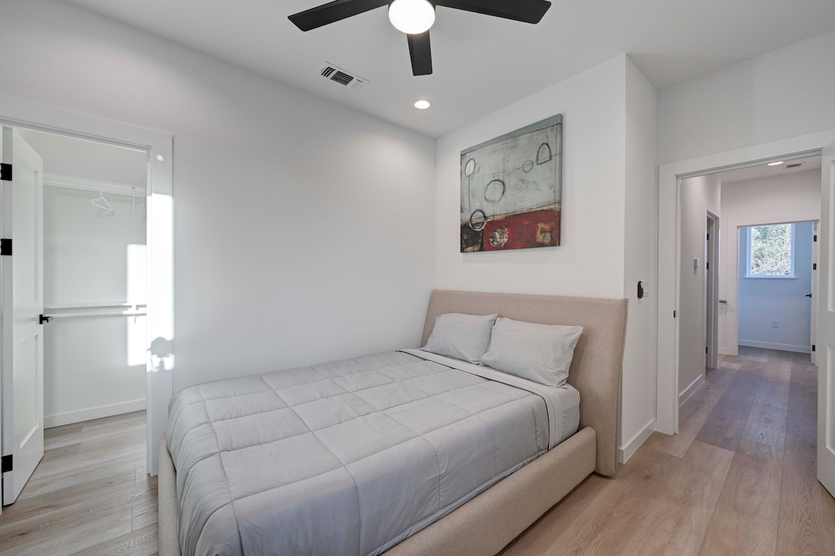2220 Yellow Jacket Lane, Unit 1 Austin, TX 78741 - Photo 19 of 35 A well-appointed sleeping area showcasing recessed lighting and wood-look flooring.