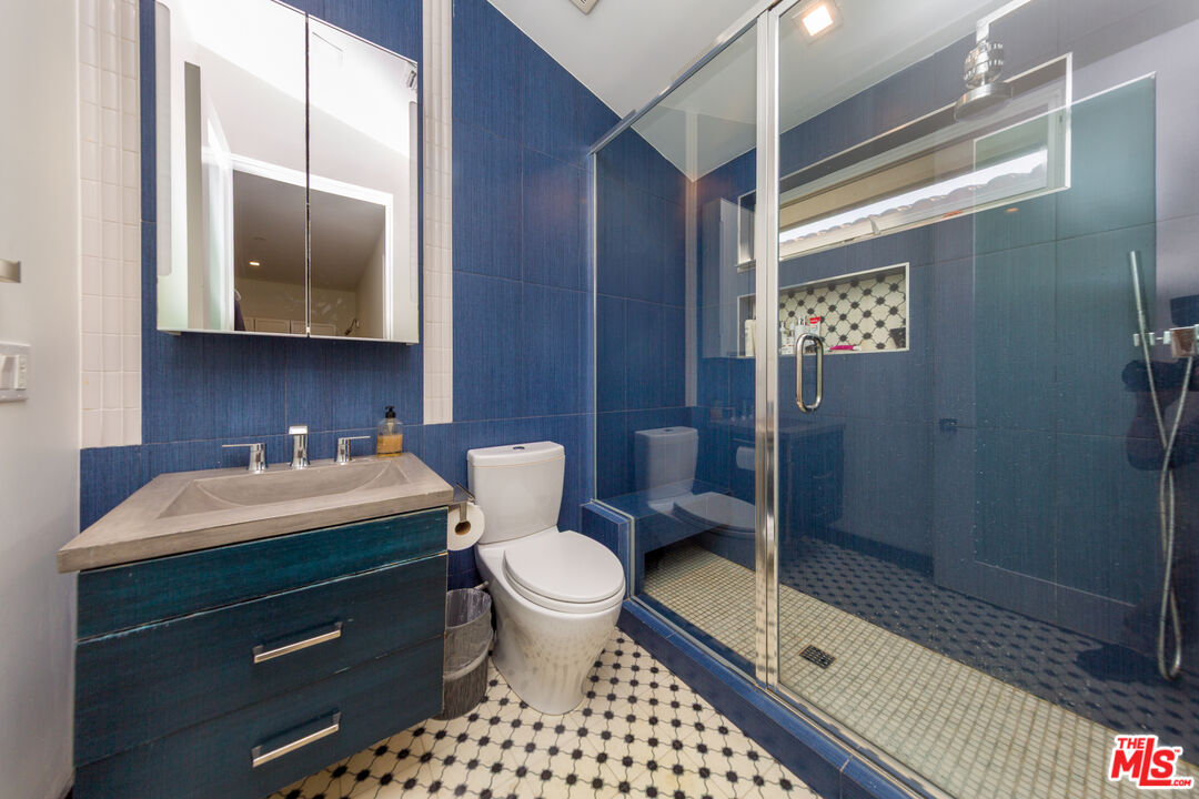 9401 Kirkside Road Los Angeles, CA 90035 - Photo 17 of 18 a bathroom with a sink toilet and shower
