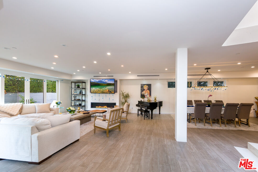 9401 Kirkside Road Los Angeles, CA 90035 - Photo 3 of 18 a living room with furniture and a wooden floor