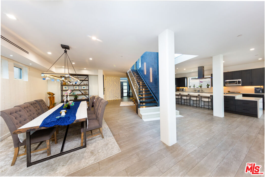 9401 Kirkside Road Los Angeles, CA 90035 - Photo 5 of 18 a living room with furniture and kitchen view