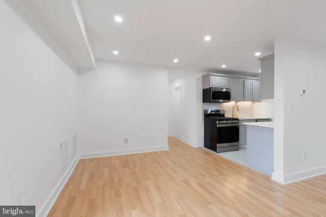 a view of kitchen with wooden floor