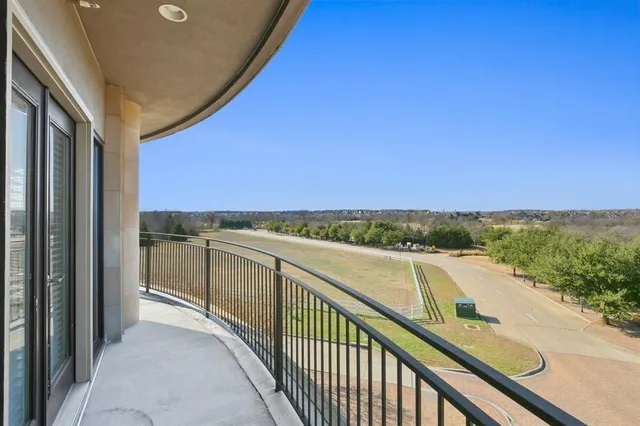 a view of balcony with furniture and city view