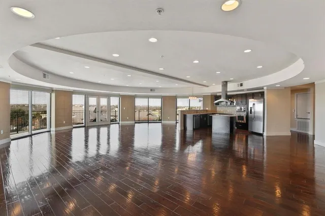 a view of dining room with furniture wooden floor and windows