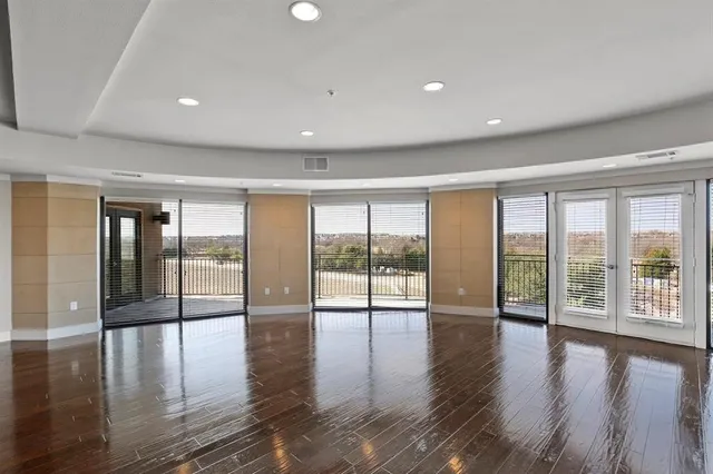 a view of an entryway with wooden floor