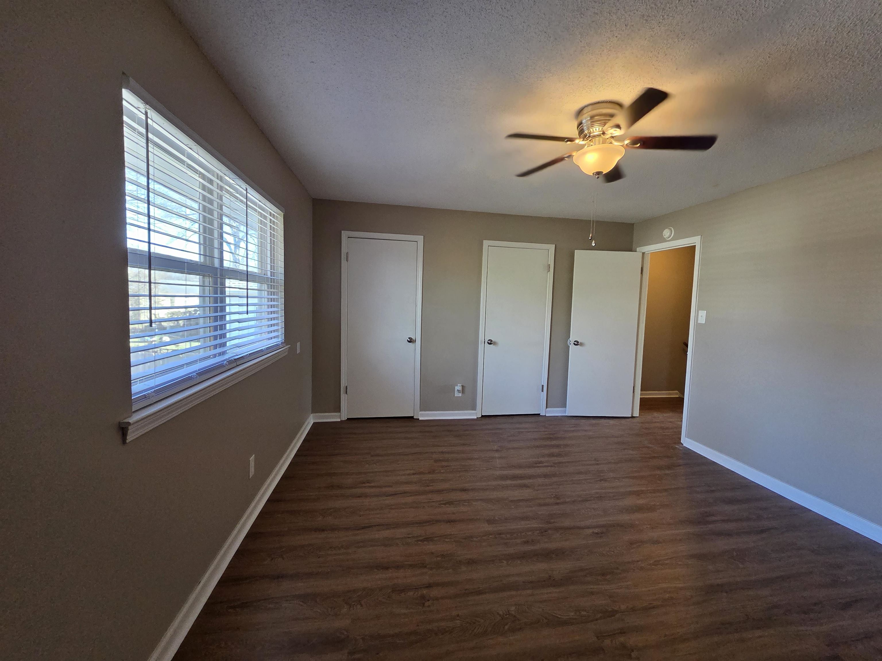 2104 Harbert Avenue Memphis, TN 38104 - Photo 11 of 26 a view of an empty room with a window and wooden floor