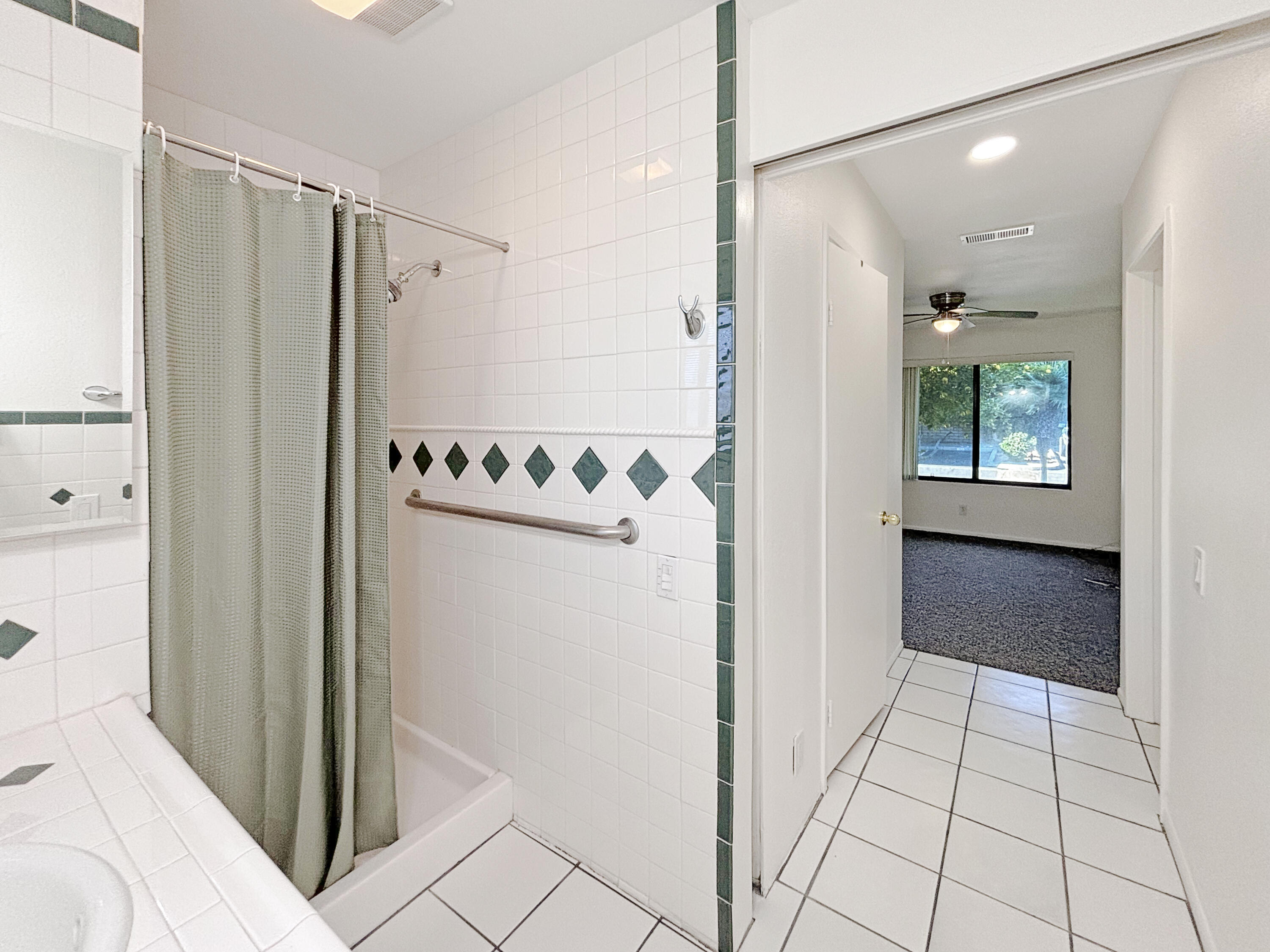 63 Lakeview Circle Cathedral City, CA 92234 - Photo 9 of 15 a bathroom with a shower and a mirror