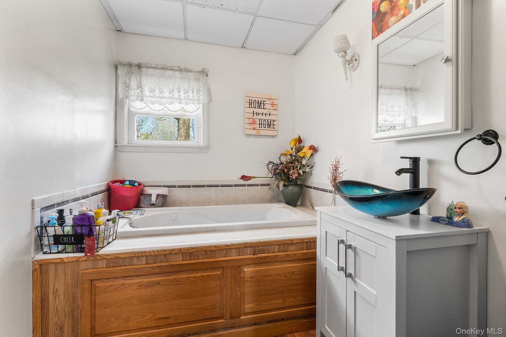43 Taylor Road Parksville, NY 12768 - Photo 17 of 29 a bathroom with a sink and a mirror