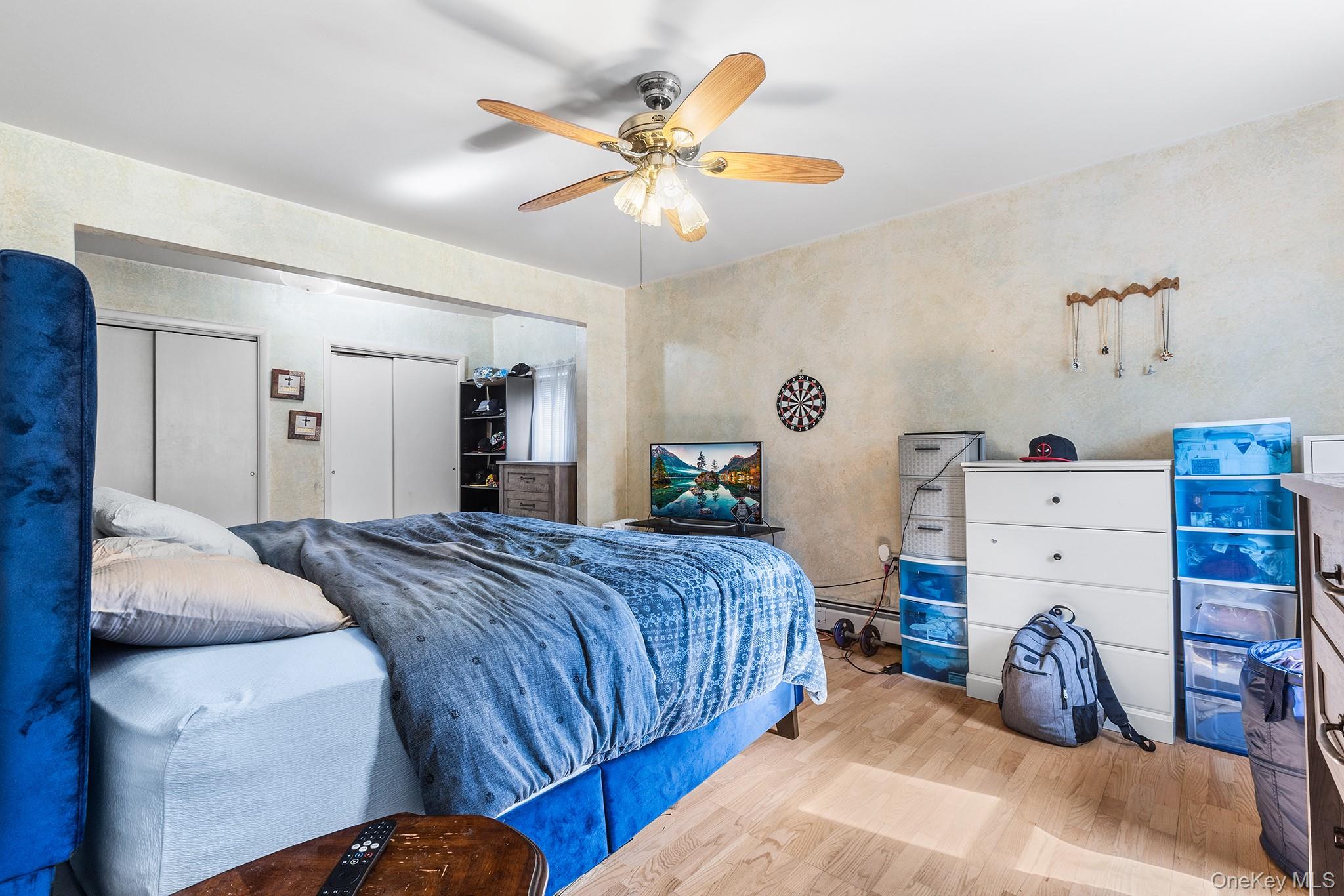 43 Taylor Road Parksville, NY 12768 - Photo 23 of 29 a bedroom with a bed and a chandelier