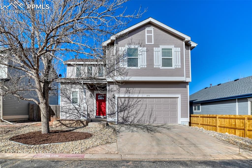 6810 Shore View Colorado Springs, CO 80922 - Photo 1 of 48 a front view of a house with entryway