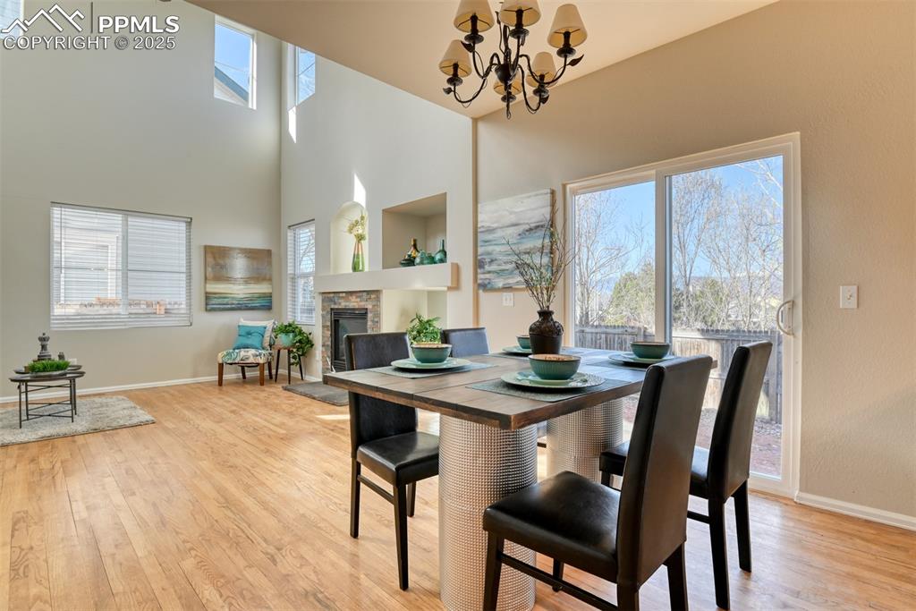6810 Shore View Colorado Springs, CO 80922 - Photo 11 of 48 a view of a dining room with furniture window and wooden floor