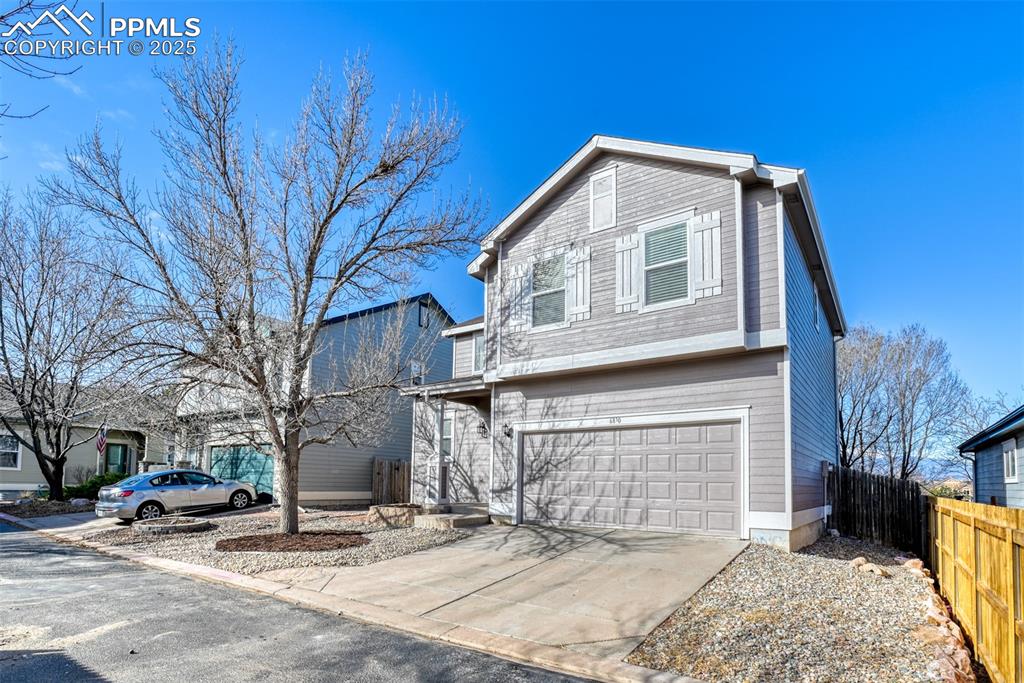6810 Shore View Colorado Springs, CO 80922 - Photo 2 of 48 a front view of a house with a yard