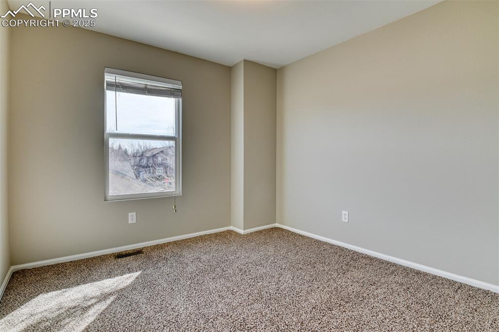 6810 Shore View Colorado Springs, CO 80922 - Photo 29 of 48 a view of an empty room with a window