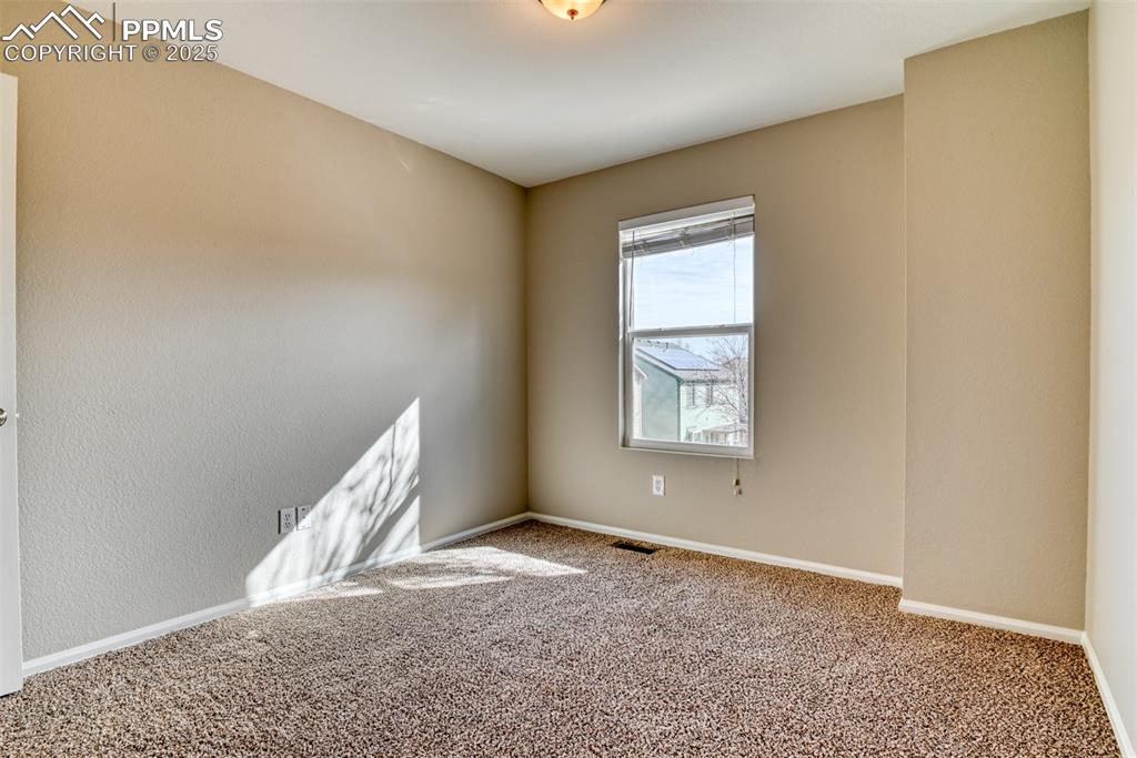 6810 Shore View Colorado Springs, CO 80922 - Photo 30 of 48 an empty room with windows