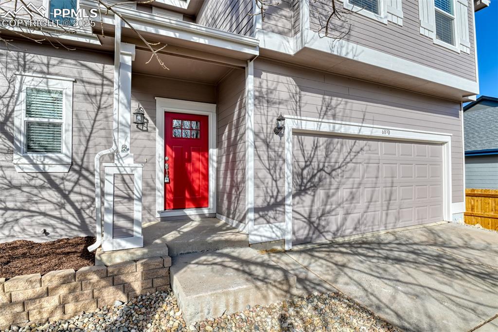 6810 Shore View Colorado Springs, CO 80922 - Photo 3 of 48 a view of a wooden door of the house