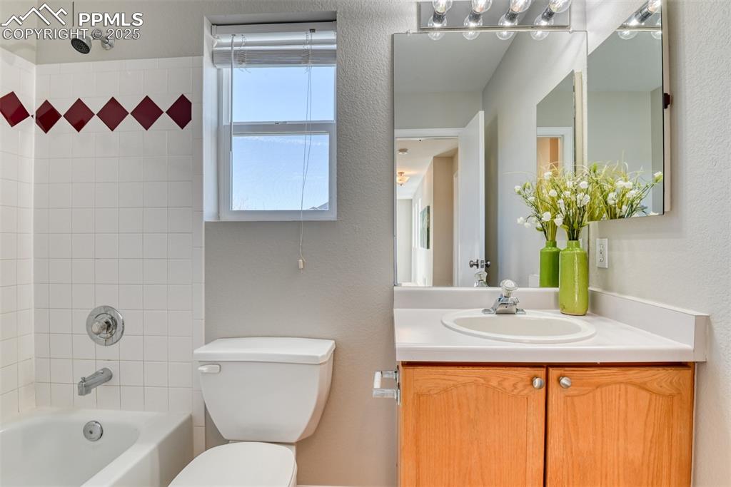 6810 Shore View Colorado Springs, CO 80922 - Photo 33 of 48 a bathroom with a sink and a mirror