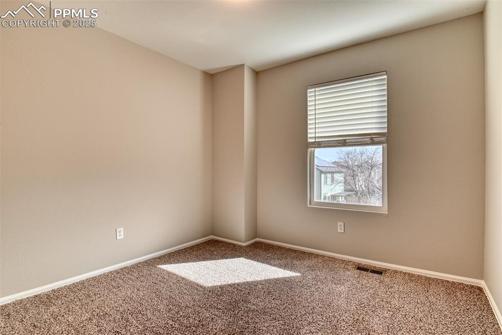 6810 Shore View Colorado Springs, CO 80922 - Photo 38 of 48 an empty room with windows