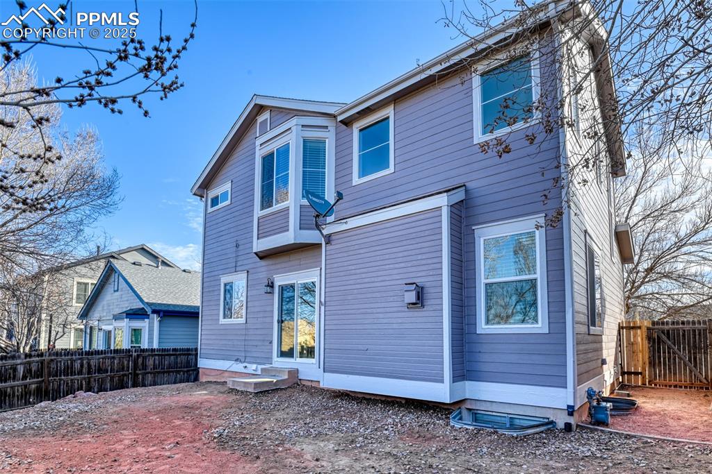 6810 Shore View Colorado Springs, CO 80922 - Photo 45 of 48 a front view of a house with garden