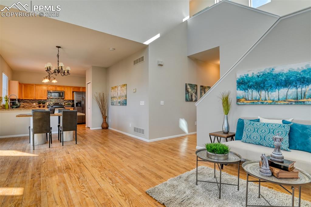 6810 Shore View Colorado Springs, CO 80922 - Photo 7 of 48 a living room with furniture and a kitchen view