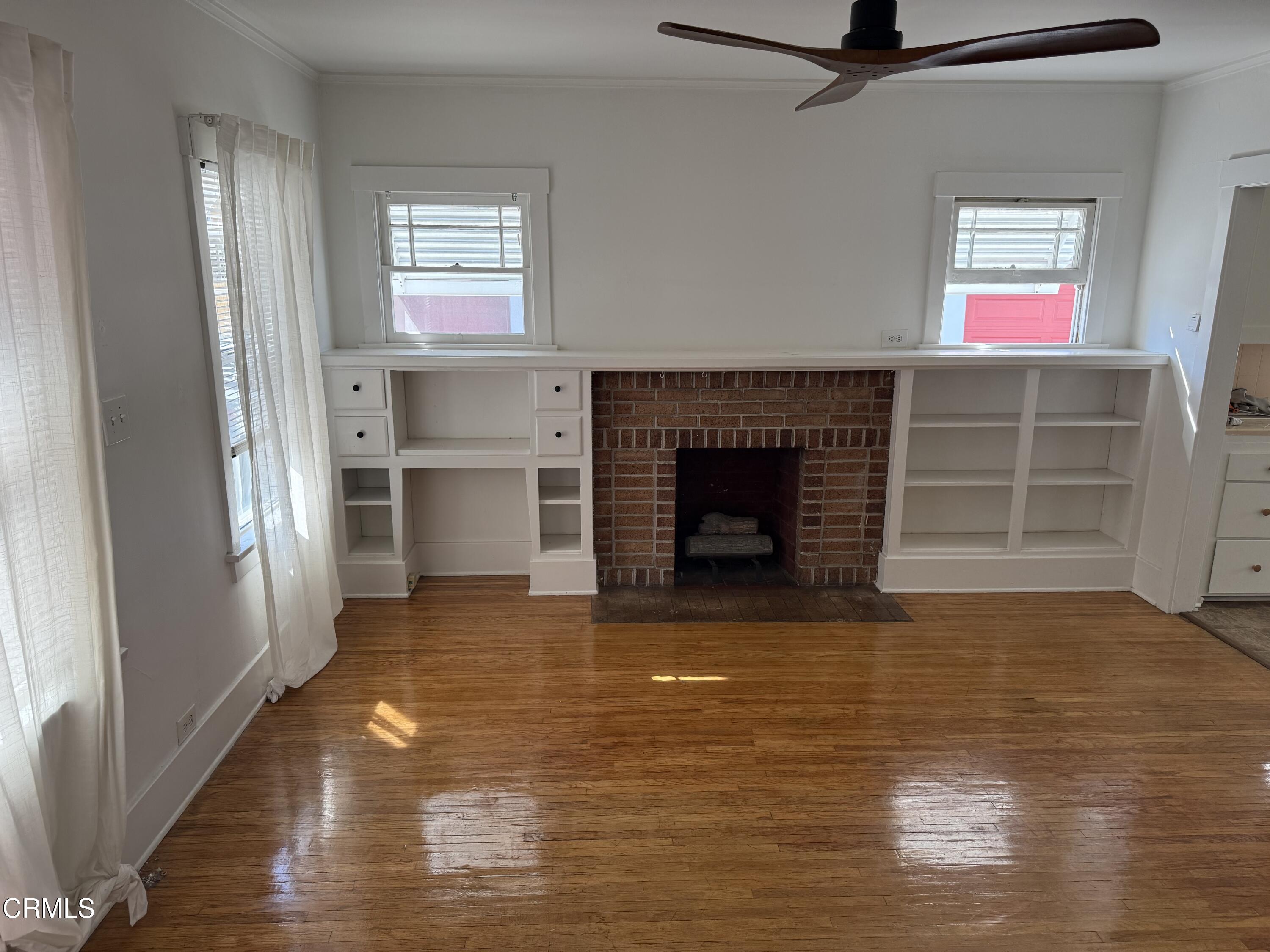 331 North Chapel Avenue Alhambra, CA 91801 - Photo 2 of 11 a view of a livingroom with a fireplace and window