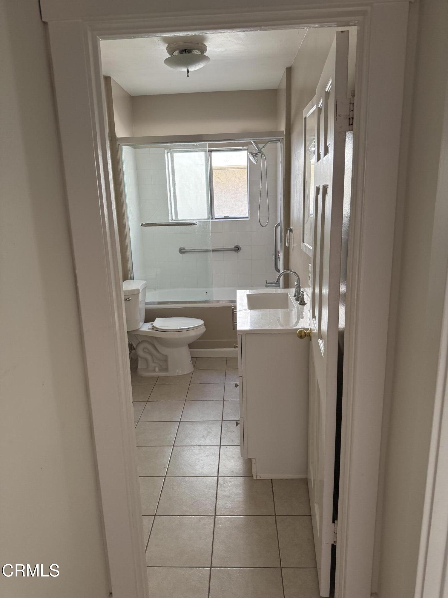 331 North Chapel Avenue Alhambra, CA 91801 - Photo 10 of 11 a bathroom with a toilet sink and mirror