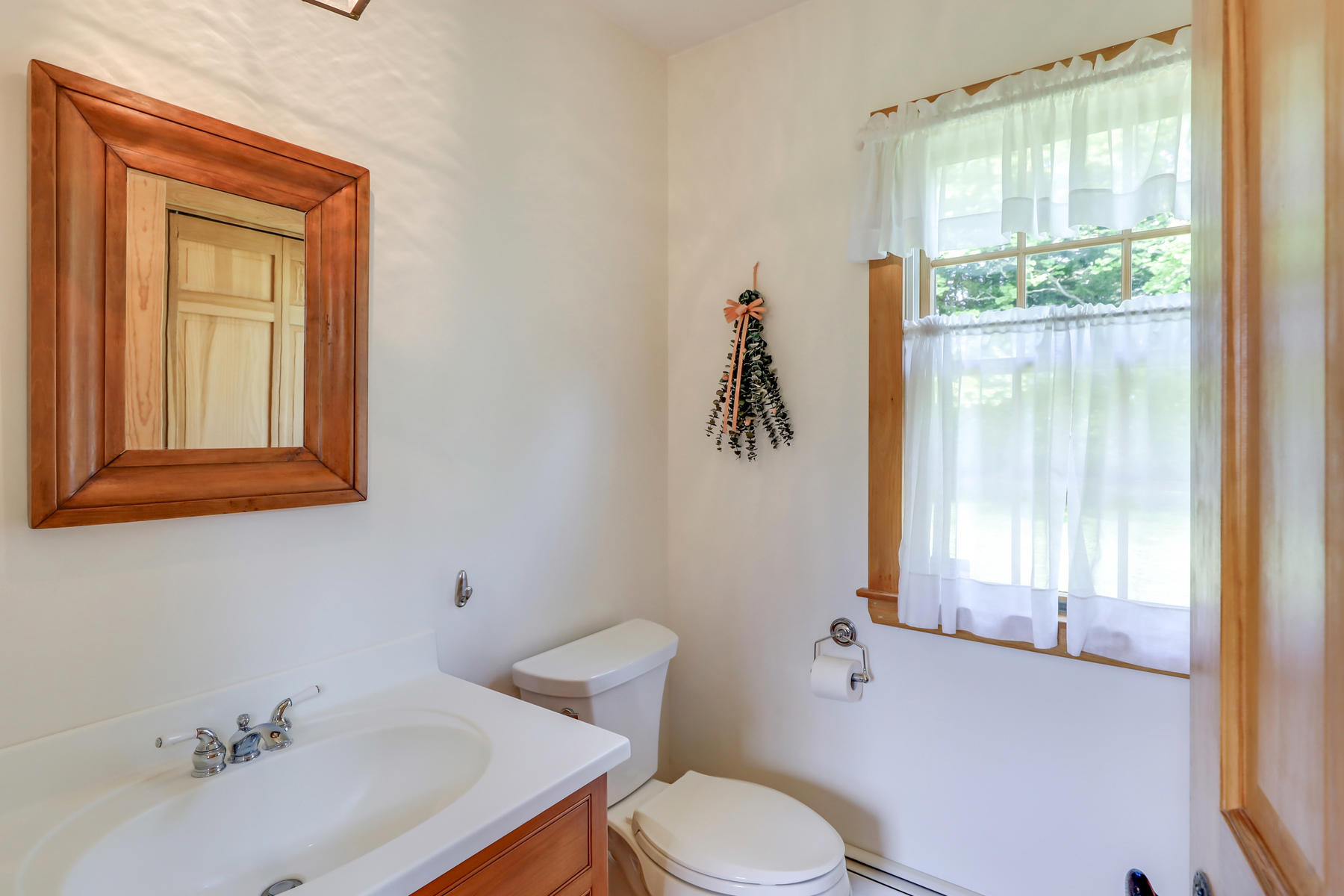 124 Barley Neck Road Orleans, MA 02653 - Photo 13 of 44 a bathroom with a sink toilet and window