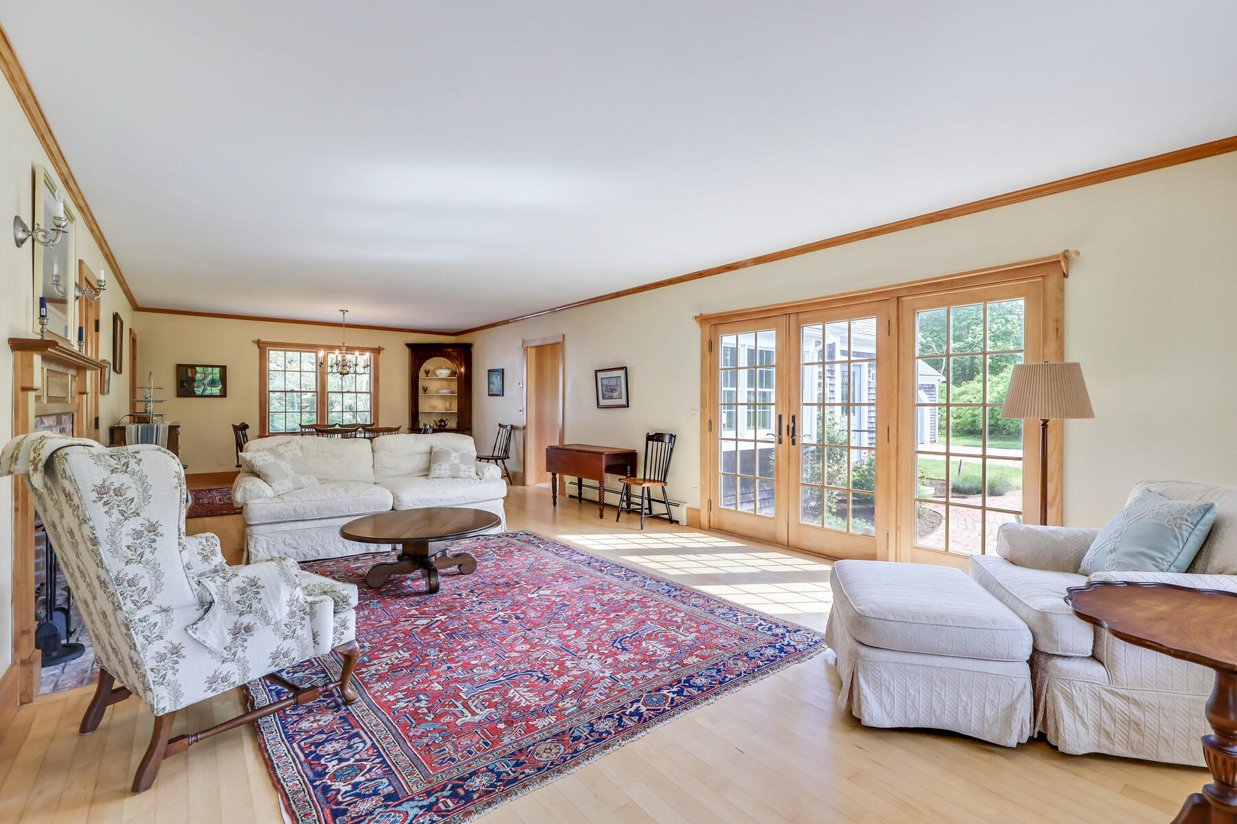 124 Barley Neck Road Orleans, MA 02653 - Photo 9 of 44 a living room with furniture large windows and wooden floor