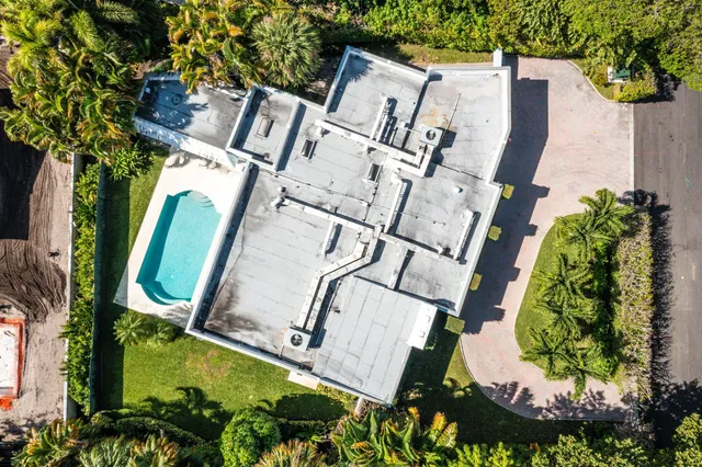an aerial view of a backyard with garden