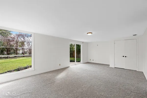 a view of an empty room with a yard