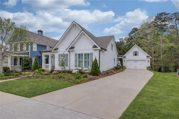 a front view of a house with garden