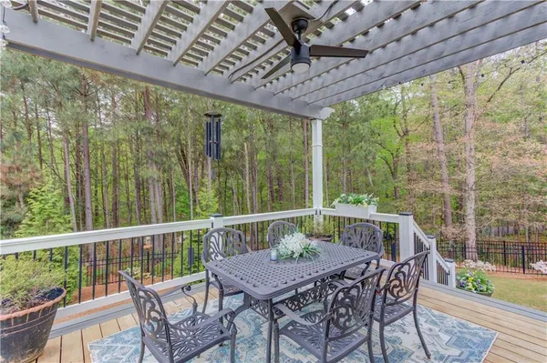 a view of a balcony with furniture