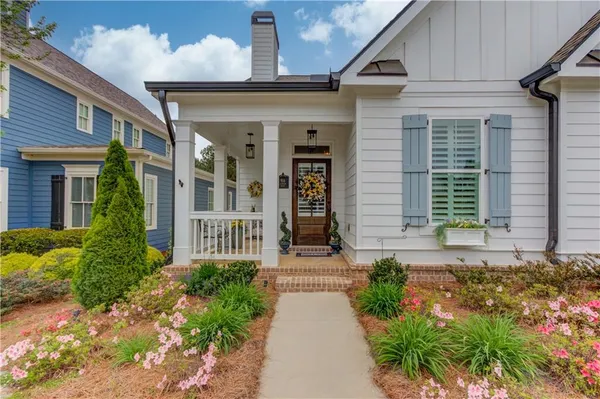 a front view of a house with garden