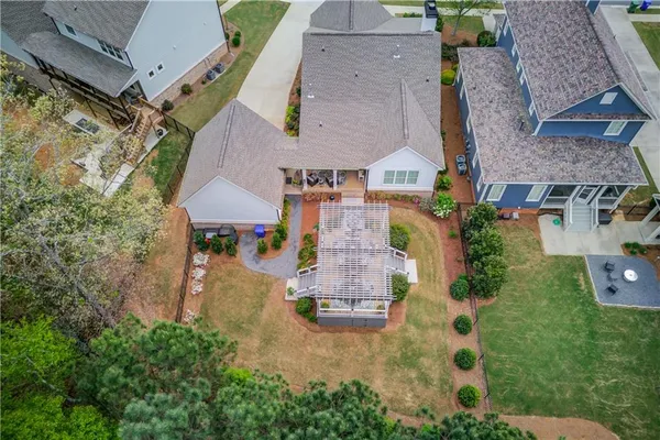 an aerial view of residential houses with outdoor space